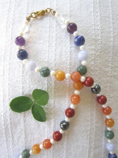 An example of a stonebead chakra necklace or mala detail.  Ein Beispiel von eine Steinperlen Chakra Halskette oder Mala Detail.
